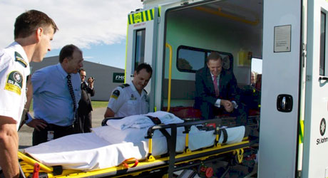 Ambulance officers showing Prime Minister Key some of their new equipment.